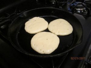 Flip pancakes only once when the bubbles start to pop.