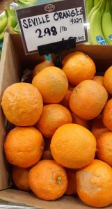 Seville oranges in bin are not all pretty