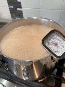 Quince jelly boiling to 220 ' F.
